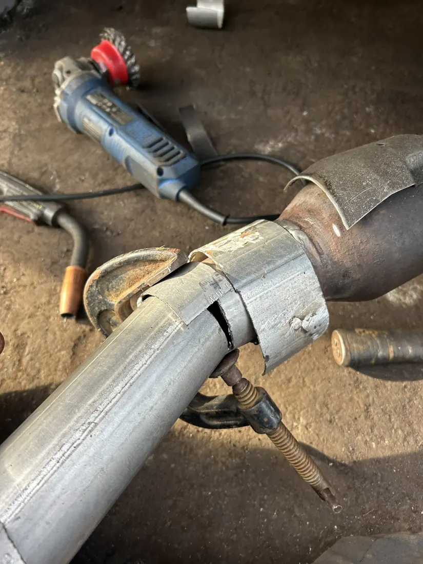 Close-up of exhaust pipe fitting before welding